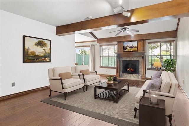 5839 Hefner Village Ct, Oklahoma City, OK 73162 - living room with beamed ceiling, wood finished floors, plenty of natural light, a fireplace, and ceiling fan