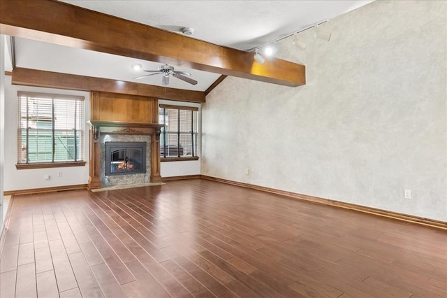 5839 Hefner Village Ct, Oklahoma City, OK 73162 - unfurnished living room with track lighting, baseboards, ceiling fan, and wood finished floors