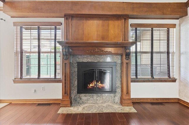 5839 Hefner Village Ct, Oklahoma City, OK 73162 - detailed view of baseboards, wood finished floors, and a fireplace