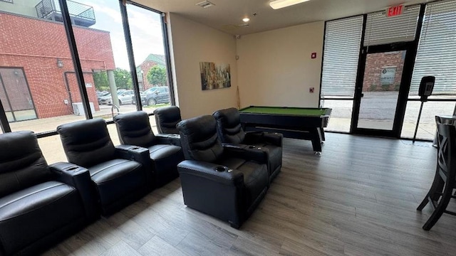 playroom featuring floor to ceiling windows, billiards, and wood finished floors