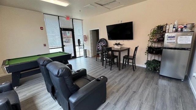 recreation room featuring billiards, wood finished floors, floor to ceiling windows, and baseboards