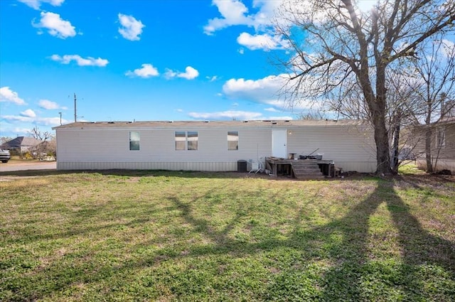 220 N Vernon Ave, Hinton, OK 73047 - rear view of property with a lawn and central AC unit
