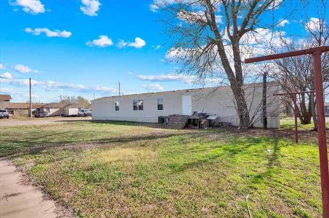 220 N Vernon Ave, Hinton, OK 73047 - view of home's exterior featuring a lawn