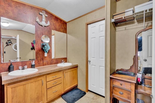 220 N Vernon Ave, Hinton, OK 73047 - full bath with vaulted ceiling, double vanity, ornamental molding, and tile patterned flooring