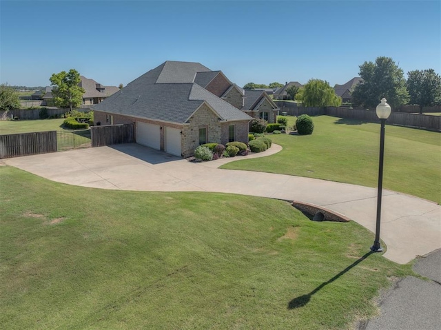239 Brandon Cir, Goldsby, OK 73093 - view of front of house with a shingled roof, driveway, stone siding, and a garage