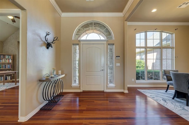 239 Brandon Cir, Goldsby, OK 73093 - entryway featuring wood finished floors, plenty of natural light, ornamental molding, and baseboards