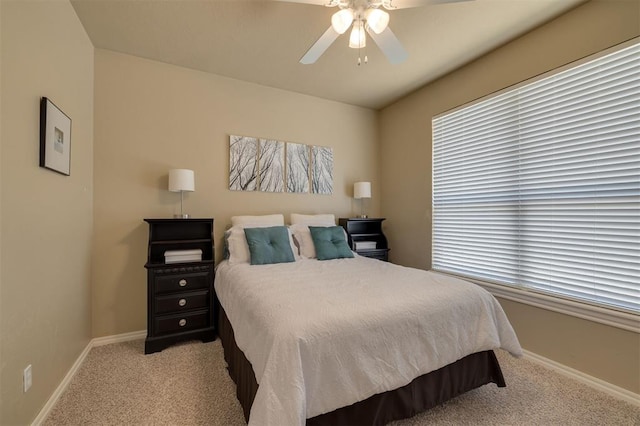 239 Brandon Cir, Goldsby, OK 73093 - carpeted bedroom featuring baseboards, a ceiling fan, and multiple windows