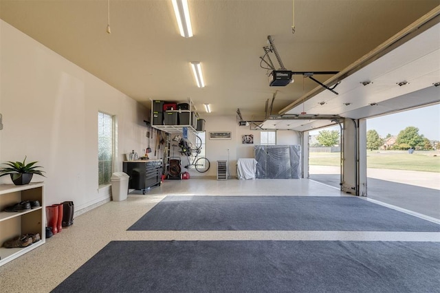239 Brandon Cir, Goldsby, OK 73093 - garage with a garage door opener and baseboards