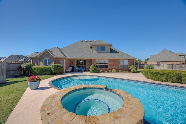 239 Brandon Cir, Goldsby, OK 73093 - view of swimming pool featuring a pool with connected hot tub and a patio