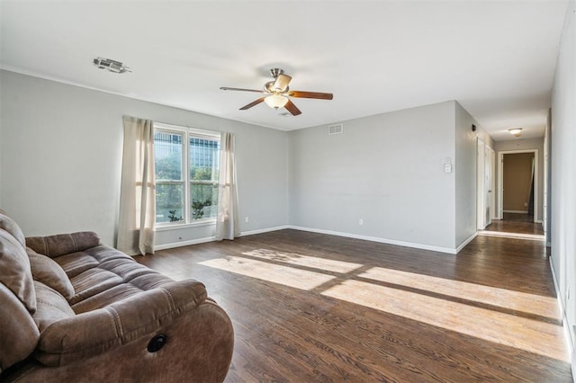 3701 NW 59th St, Oklahoma City, OK 73112 - living room featuring ceiling fan, dark wood-type flooring, and baseboards