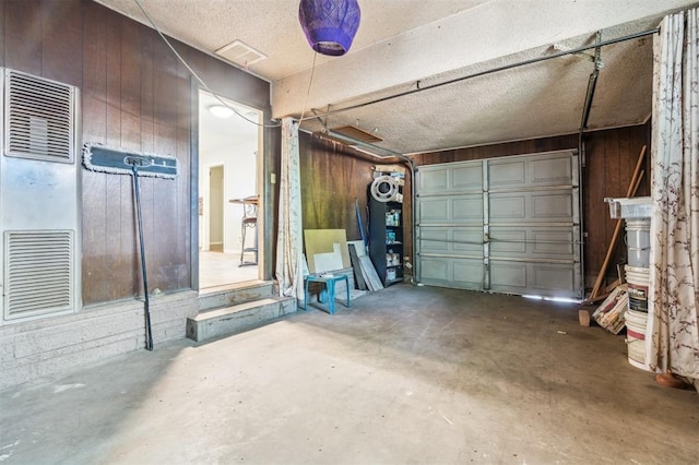 3701 NW 59th St, Oklahoma City, OK 73112 - garage with wooden walls and a heating unit