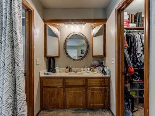 312 Carlsbad Ct, Yukon, OK 73099 - bathroom featuring vanity and a spacious closet
