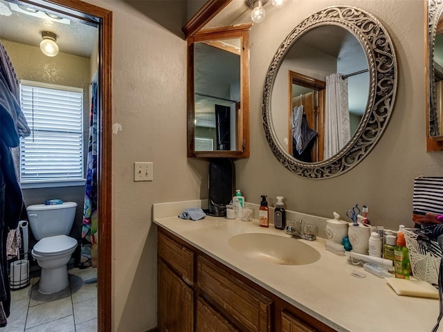 312 Carlsbad Ct, Yukon, OK 73099 - bathroom featuring tile patterned flooring, toilet, and vanity