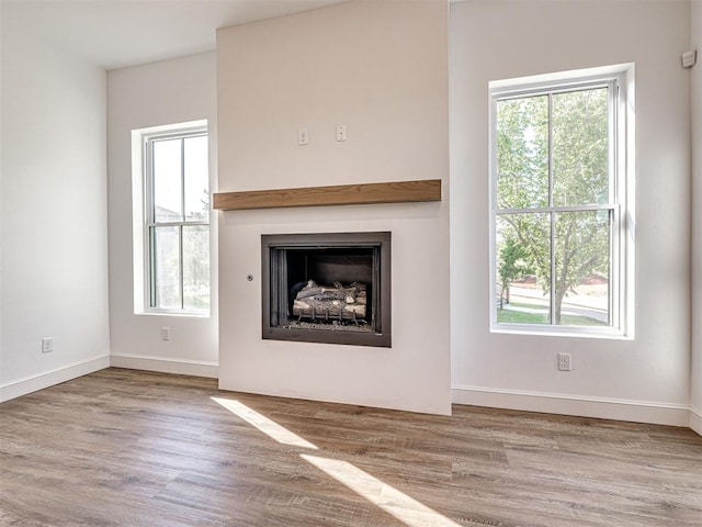 29612 Memory Ln, Norman, OK 73072 - unfurnished living room with plenty of natural light and wood finished floors
