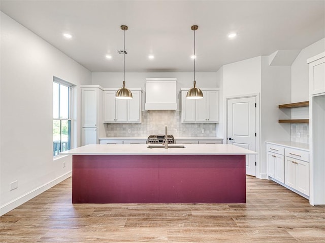 29612 Memory Ln, Norman, OK 73072 - kitchen featuring premium range hood, white cabinets, tasteful backsplash, a sink, and recessed lighting