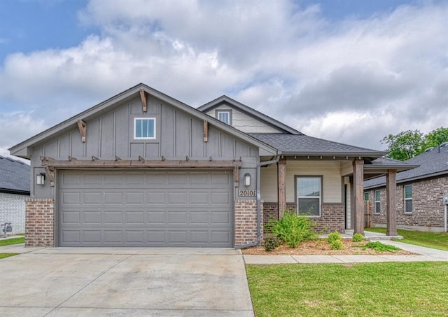 20101 Park Ln, Harrah, OK 73045 - view of front of home with brick siding, driveway, and board and batten siding