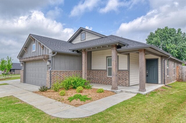 20101 Park Ln, Harrah, OK 73045 - view of front of property featuring brick siding, an attached garage, a shingled roof, and concrete driveway