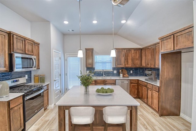 20101 Park Ln, Harrah, OK 73045 - kitchen with stainless steel appliances, light wood-style floors, backsplash, a sink, and light countertops