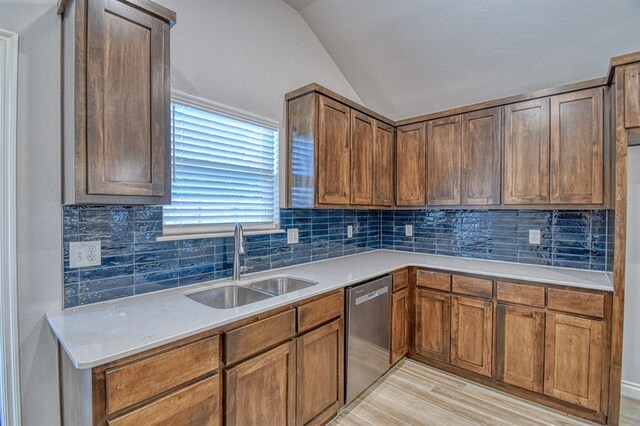 20101 Park Ln, Harrah, OK 73045 - kitchen with a sink, lofted ceiling, dishwasher, decorative backsplash, and light countertops