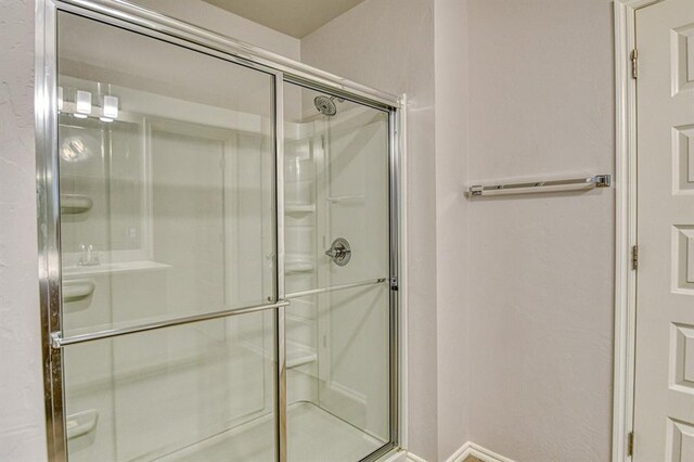 20101 Park Ln, Harrah, OK 73045 - bathroom with a shower stall and baseboards