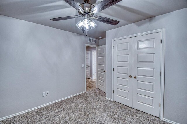 20101 Park Ln, Harrah, OK 73045 - unfurnished bedroom featuring baseboards, carpet flooring, a closet, and ceiling fan
