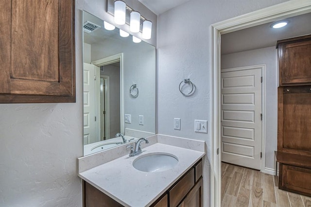 20101 Park Ln, Harrah, OK 73045 - bathroom with wood finished floors and vanity