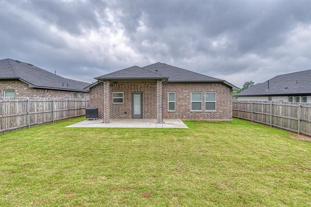20101 Park Ln, Harrah, OK 73045 - rear view of property with cooling unit, brick siding, a patio, and roof with shingles