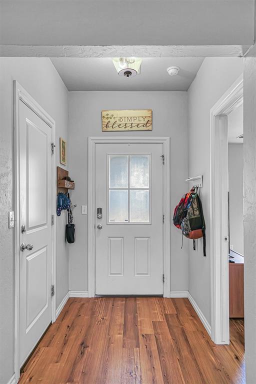 1537 Avalon Dr, Altus, OK 73521 - entryway with wood finished floors and baseboards