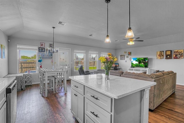 1537 Avalon Dr, Altus, OK 73521 - kitchen featuring dark wood-type flooring, a ceiling fan, dishwasher, light stone countertops, and pendant lighting