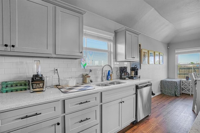 1537 Avalon Dr, Altus, OK 73521 - kitchen with stainless steel dishwasher, a sink, gray cabinetry, dark wood finished floors, and plenty of natural light