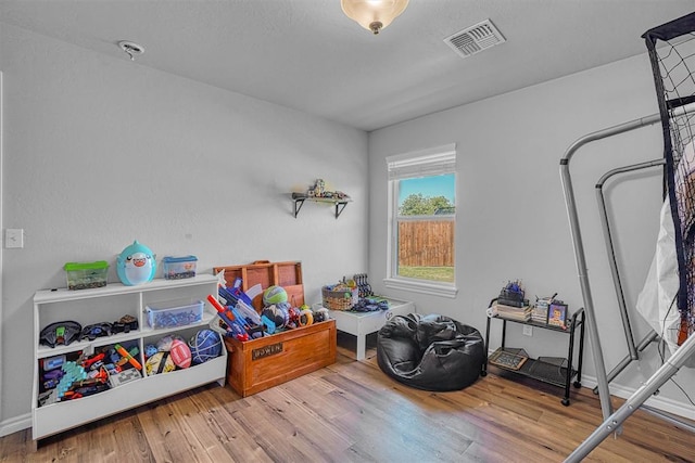 1537 Avalon Dr, Altus, OK 73521 - playroom with wood finished floors and baseboards