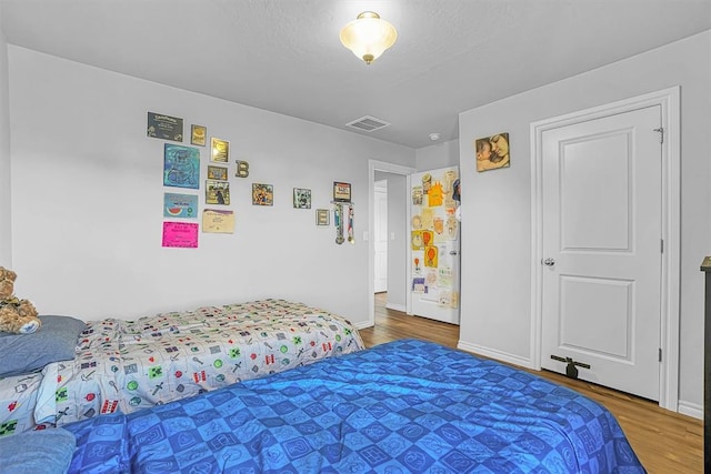 1537 Avalon Dr, Altus, OK 73521 - bedroom with wood finished floors and baseboards