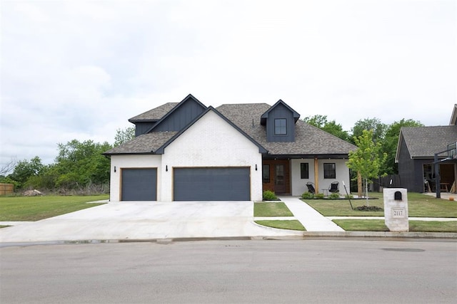 2117 Aminas Way, Yukon, OK 73099 - modern farmhouse featuring an attached garage, a front lawn, and concrete driveway