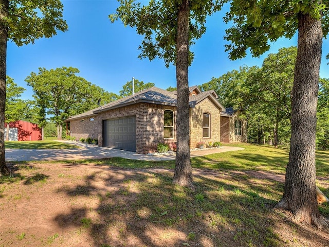 940437 S 3310th Rd, Wellston, OK 74881 - ranch-style home with brick siding, driveway, an attached garage, and a front lawn
