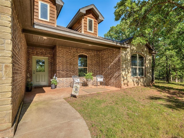 940437 S 3310th Rd, Wellston, OK 74881 - entrance to property with brick siding, a lawn, and a patio