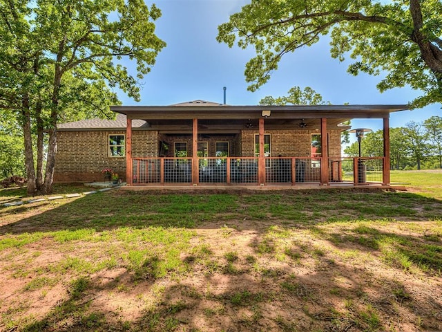 940437 S 3310th Rd, Wellston, OK 74881 - rear view of property featuring brick siding and a ceiling fan