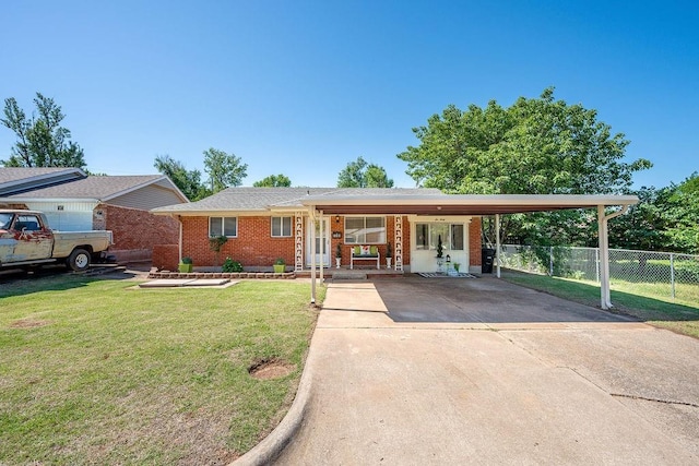 640 SW 1st Pl, Moore, OK 73160 - ranch-style house with brick siding, concrete driveway, and a carport