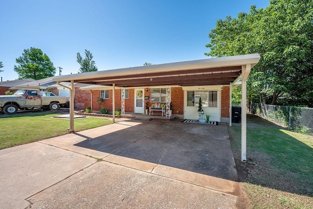640 SW 1st Pl, Moore, OK 73160 - view of front of property with brick siding, a carport, and concrete driveway
