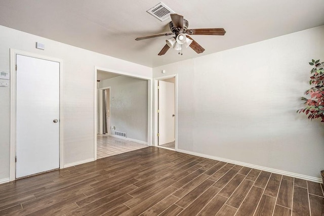 640 SW 1st Pl, Moore, OK 73160 - empty room with ceiling fan, wood finished floors, and baseboards