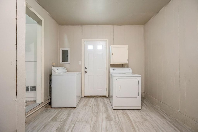 640 SW 1st Pl, Moore, OK 73160 - washroom featuring separate washer and dryer, electric panel, and cabinet space