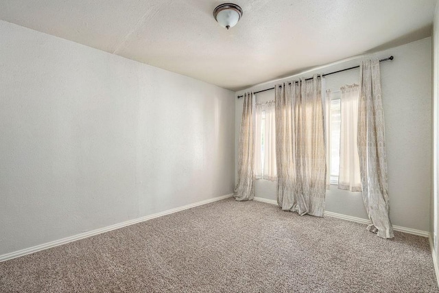 640 SW 1st Pl, Moore, OK 73160 - spare room featuring light colored carpet and baseboards