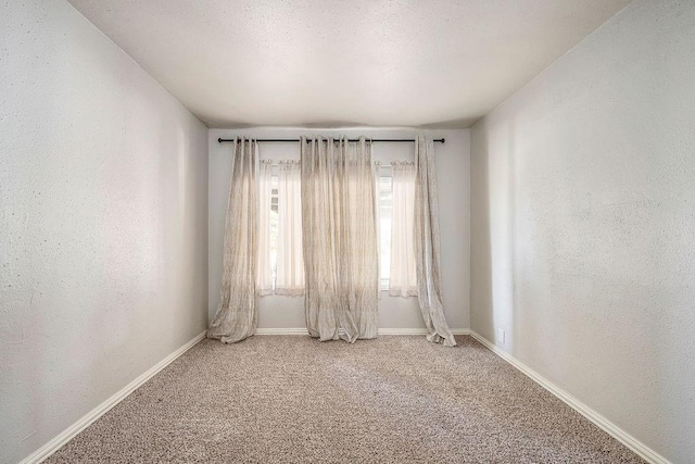 640 SW 1st Pl, Moore, OK 73160 - unfurnished room featuring carpet floors, baseboards, and a textured wall