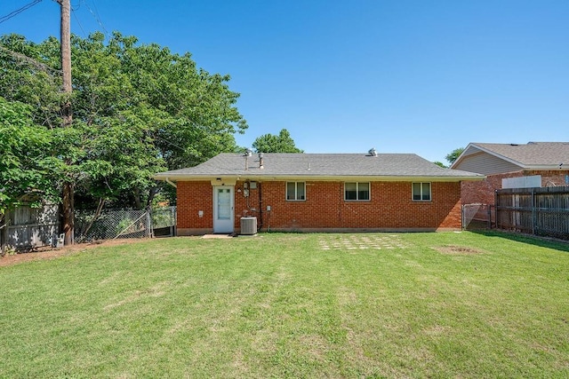 640 SW 1st Pl, Moore, OK 73160 - rear view of house featuring central air condition unit and brick siding
