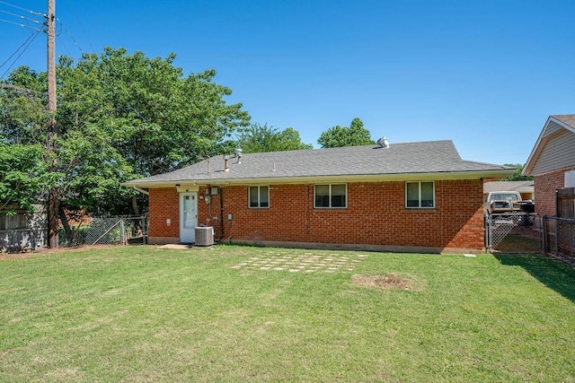 640 SW 1st Pl, Moore, OK 73160 - back of property with a gate, central air condition unit, and brick siding