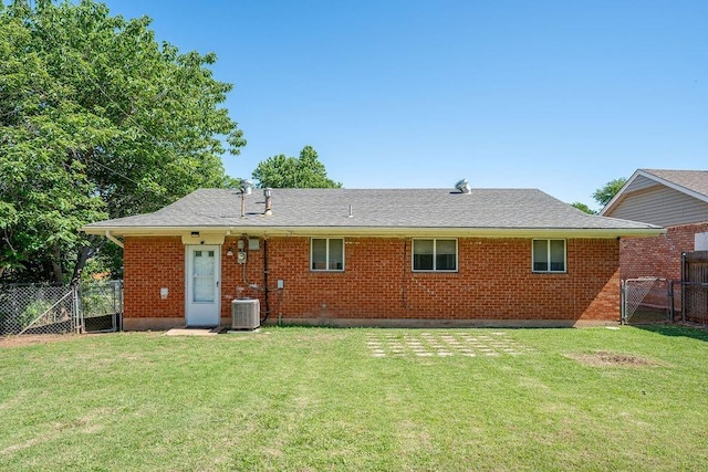 640 SW 1st Pl, Moore, OK 73160 - back of house with a gate, brick siding, and central AC