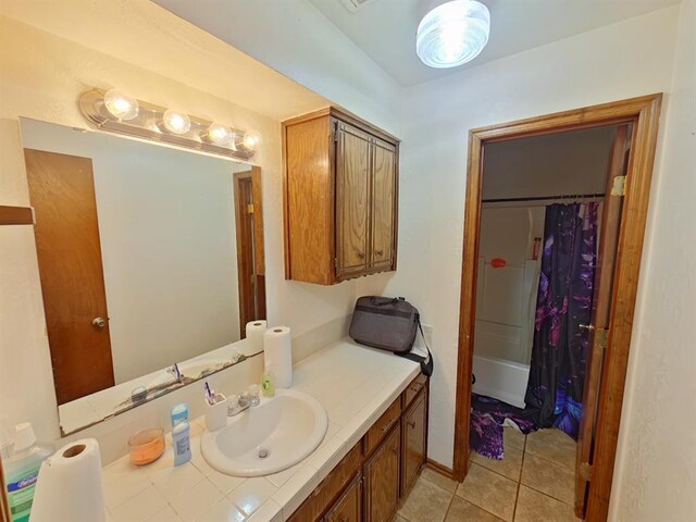2317 County Road 1268, Blanchard, OK 73010 - full bath with tile patterned floors, vanity, and shower / bath combination with curtain