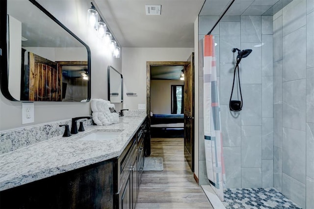 4575 Hidden Path, Kingston, OK 73439 - full bath with a shower stall, wood finished floors, and vanity