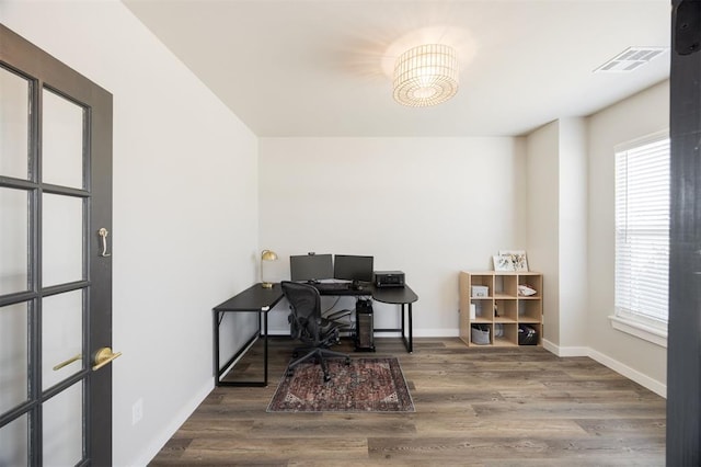home office featuring wood finished floors and baseboards