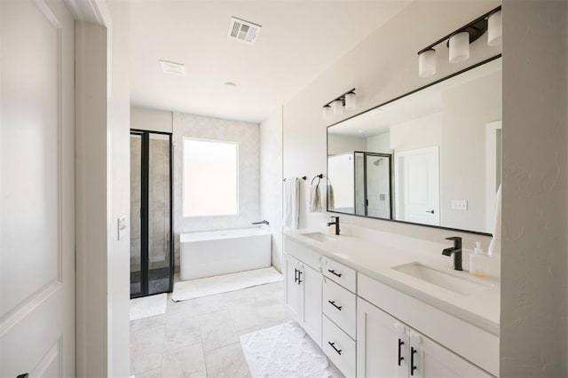 bathroom with a shower stall, a bathtub, and double vanity