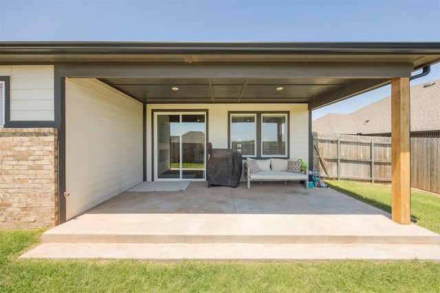 view of patio / terrace featuring fence